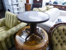 A LOW CIRCULAR TOP BAKELITE COFFEE TABLE