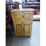 A 1930's BLOND OAK DRINKS CABINET WITH MIRRORED INTERIOR