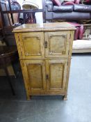 A 1930's BLOND OAK DRINKS CABINET WITH MIRRORED INTERIOR