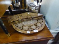 A CARVED AND PIERCED WOOD EASTERN CIRCULAR LAMP TABLE