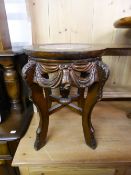 AN ORIENTAL CARVED PADOUK WOOD URN STAND WITH INSET MARBLE TOP