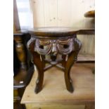 AN ORIENTAL CARVED PADOUK WOOD URN STAND WITH INSET MARBLE TOP