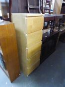 A TALL NARROW LIGHTWOOD CHEST OF FIVE DRAWERS