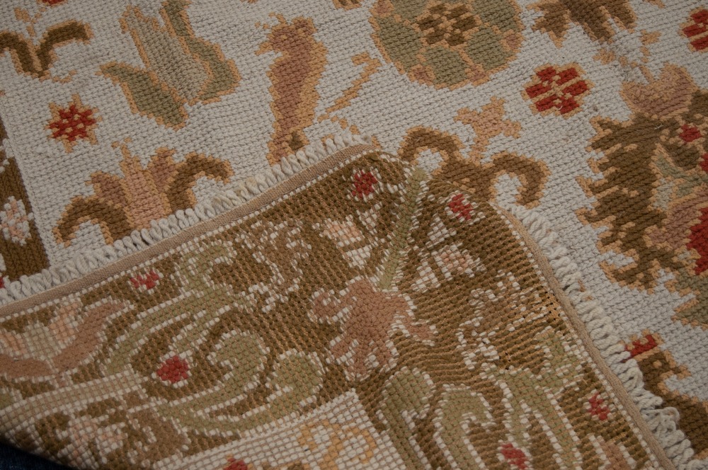 EASTERN FLAT WEAVE CARPET, with all-over formed floral and bird design on a cream field, broad - Image 2 of 4