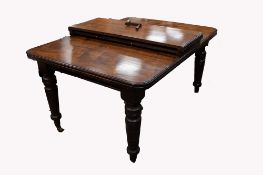 A VICTORIAN MAHOGANY WIND-OUT EXTENDING DINING TABLE WITH TWO ADDITIONAL LEAVES , the rounded oblong