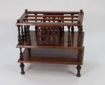 LATE VICTORIAN CARVED WALNUT MUSIC CANTERBURY, the galleried top with three long division, pierced