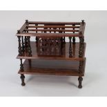 LATE VICTORIAN CARVED WALNUT MUSIC CANTERBURY, the galleried top with three long division, pierced