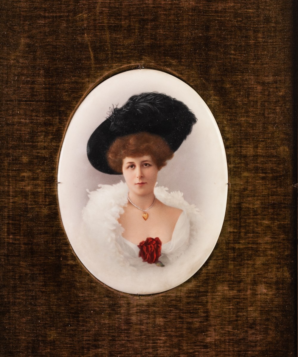 PAIR OF EDWARDIAN TINTED PHOTOGRAPHIC PORTRAITS, each of an elegant lady, on Continental oval