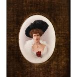 PAIR OF EDWARDIAN TINTED PHOTOGRAPHIC PORTRAITS, each of an elegant lady, on Continental oval