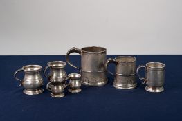 TWO VICTORIAN PEWTER 'GILL' BELLY MEASURES, 3" high, TWO SIMILAR SMALLER MEASURES, 2" high;