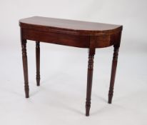 GEORGIAN FIGURED MAHOGANY FOLD-OVER TEA TABLE, with D shaped top and turned legs