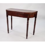 GEORGIAN FIGURED MAHOGANY FOLD-OVER TEA TABLE, with D shaped top and turned legs