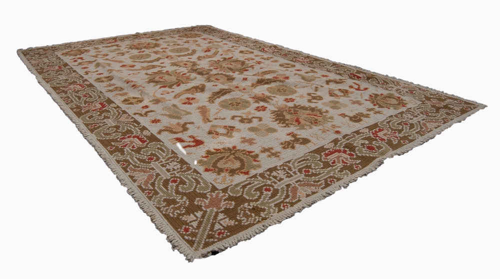 EASTERN FLAT WEAVE CARPET, with all-over formed floral and bird design on a cream field, broad
