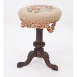 EARLY VICTORIAN CARVED ROSEWOOD ADJUSTABLE PIANO STOOL, the padded, circular seat, with floral