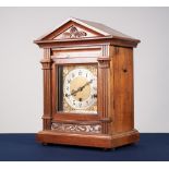 TWENTIETH CENTURY CARVED WALNUT MANTLE CLOCK, the 6 ½" brass dial with silvered Arabic chapter ring,
