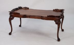 GEORGIAN STYLE CARVED MAHOGANY OCCASIONAL TABLE, the shaped oblong top with pierced and carved