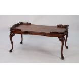 GEORGIAN STYLE CARVED MAHOGANY OCCASIONAL TABLE, the shaped oblong top with pierced and carved