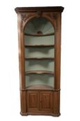 GEORGIAN STYLE WAXED PINE BARREL BACKED FLOOR STANDING CORNER CUPBOARD, the foliate carved and