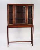 NINETEENTH CENTURY MAHOGANY DISPLAY CABINET ON STAND, the top section in the Oriental style with a