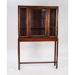 NINETEENTH CENTURY MAHOGANY DISPLAY CABINET ON STAND, the top section in the Oriental style with a