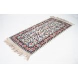 MODERN TUNISIAN WOOL PILE RUG, in Persian taste with fringed ends, 58" x 28" (147 x 71cm)