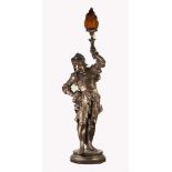 LARGE PATINATED SPELTER FIGURAL TABLE LAMP, modelled as a soldier, part clad in armour and holding a