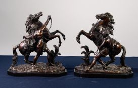 AFTER NICOLAS COUSTOU (1658-1733), PAIR OF PATINATED BRONZE GROUPS OF THE MARLY HORSES, each