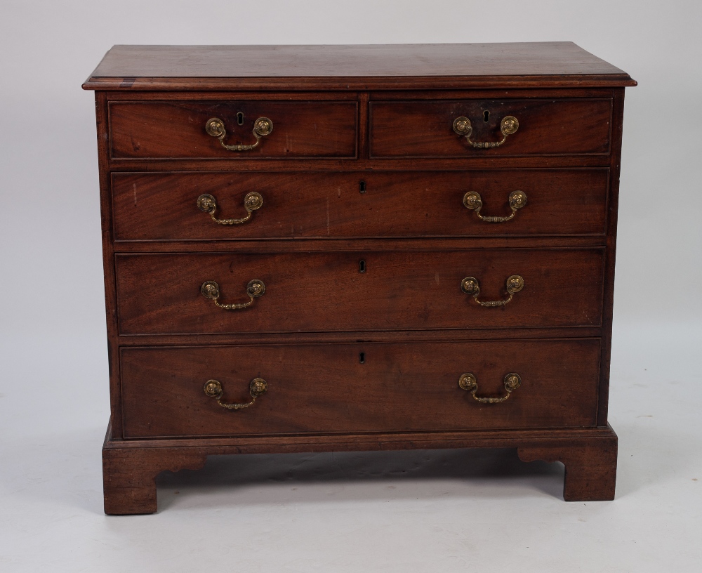 GEORGE III MAHOGANY CHEST OF DRAWERS, the moulded oblong top above two short and three long