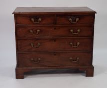 GEORGE III MAHOGANY CHEST OF DRAWERS, the moulded oblong top above two short and three long