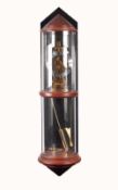 MODERN HERMLE, GERMAN SKELETON TYPE BRASS WALL CLOCK IN CYLINDRICAL GLASS CASE, the clock silvered