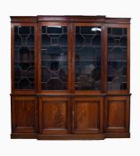 NINETEENTH CENTURY FIGURED MAHOGANY BREAK FRONT LIBRARY BOOKCASE, the moulded, flame cut cornice