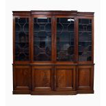 NINETEENTH CENTURY FIGURED MAHOGANY BREAK FRONT LIBRARY BOOKCASE, the moulded, flame cut cornice