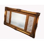 A TRIPTYCH GILT WALL MIRROR WITH CENTRAL BEVEL GLASS HAVING MARBLE PLAQUES TO THE SIDES after