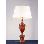 CARVED AND TURNED WALNUT TABLE LAMP, of slender lidded urn form with turned pedestal base and the