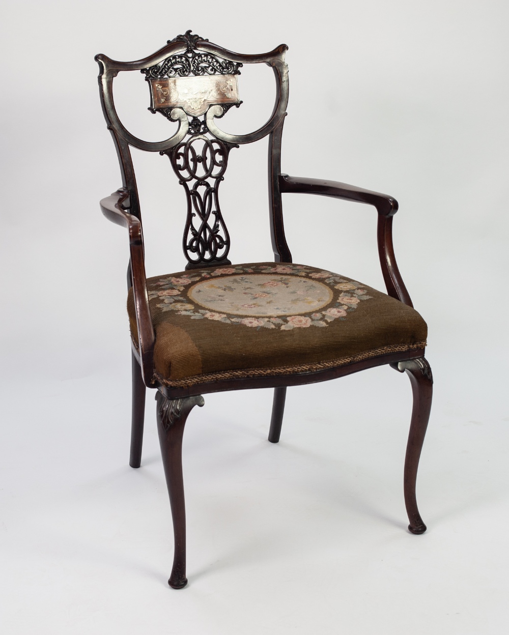 EDWARDIAN INLAID AND CARVED MAHOGANY DRAWING ROOM OPEN ARMCHAIR, the scrollwork back with pierced