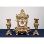 LATE NINETEENTH/ EARLY TWENTIETH CENTURY EMBOSSED BRASS MANTLE CLOCK, the 3 ½" Arabic dial with