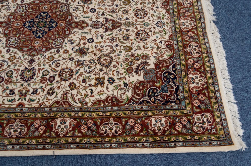 A MODERN PERSIAN WOOL PILE RUG, the cream field with a central medallion surrounded with stylized - Image 2 of 3