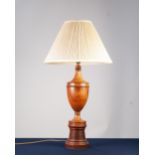 TURNED TEAKWOOD TABLE LAMP, of slender lidded urn form with ring turned pedestal base and the