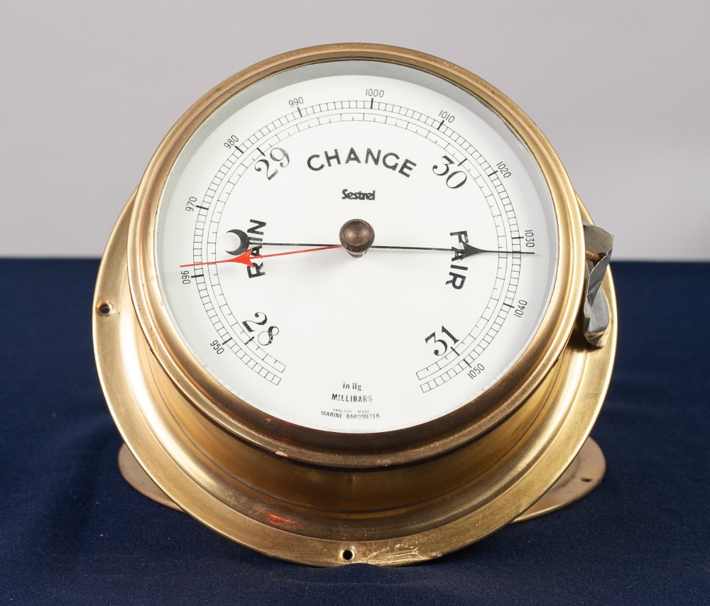 'SESTREL' ENGLISH MADE MARINE ANEROID BAROMETER, in brass circular mural case, 8" diameter and