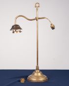 EARLY TWENTIETH CENTURY ADJUSTABLE BRASS DESK LAMP, with carrying handle, scroll arm and weighted