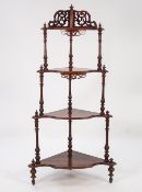 VICTORIAN BURR WALNUT FOUR TIER CORNER WHAT NOT, of graduated form with scroll pierced back,