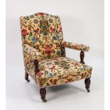 EARLY TWENTIETH CENTURY EASY ARMCHAIR, with arched top rail, flat arms with turned and fluted