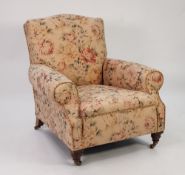 LATE NINETEENTH/ EARLY TWENTIETH CENTURY UPHOLSTERED EASY ARM CHAIR, with arched top rail, scroll