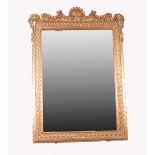 MODERN GEORGIAN STYLE CARVED GILTWOOD WALL MIRROR, the oblong plate housed in an ornate frame,