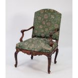 NINETEENTH CENTURY CONTINENTAL CARVED WALNUT FAUTEUIL, the arched back above moulded, wavy arms with
