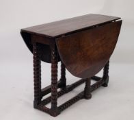 ANTIQUE OAK DROP LEAF GATELEG DINING TABLE, the oval top above a bobbin turned base, 28" (71.1cm)