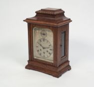 A CIRCA 1900 OAK CASED MANTEL CLOCK, the Gustav Becker three train chiming movement with a