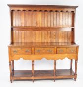 LATE EIGHTEENTH CENTURY OAK SMALL DRESSER, the back with moulded cornice, shaped frieze and single