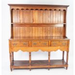 LATE EIGHTEENTH CENTURY OAK SMALL DRESSER, the back with moulded cornice, shaped frieze and single