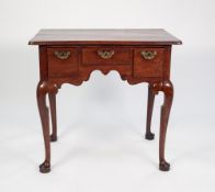 A GEORGE II RED WALNUT LOW BOY, the plain top with thumb moulded edge above three ovolo moulded